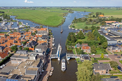 High angle view of townscape by sea