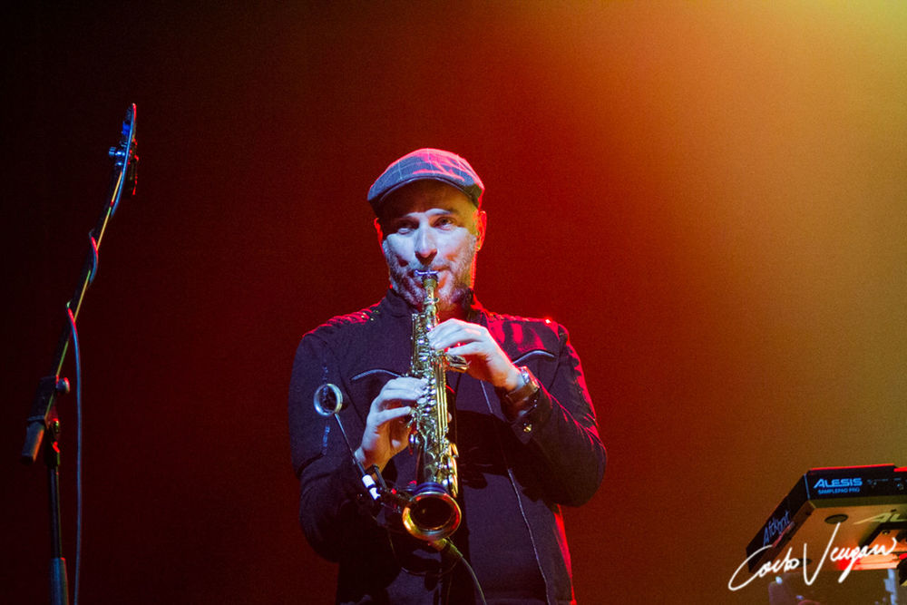 music, musical instrument, arts culture and entertainment, performance, one person, wind instrument, artist, musician, playing, skill, saxophone, waist up, men, holding, real people, musical equipment, front view, brass instrument, illuminated, stage, brass, trumpet, entertainment occupation, nightlife