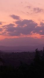 Scenic view of silhouette landscape against sky during sunset