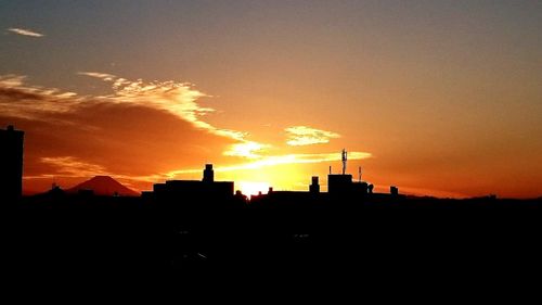 Silhouette of buildings at sunset