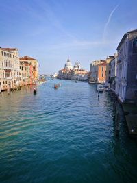 Canal passing through city buildings