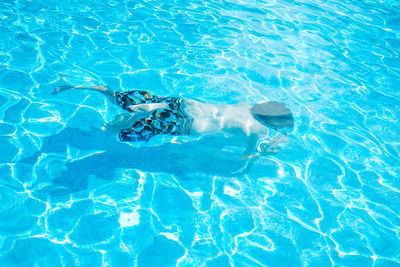 High angle view of person swimming in pool