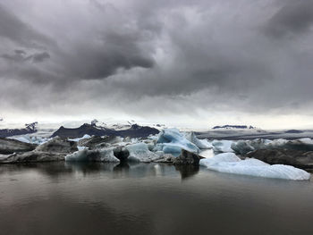 Scenic view of frozen lake against sky