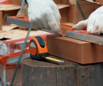 Close-up of hand working on table
