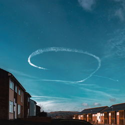 Low angle view of vapor trails in sky