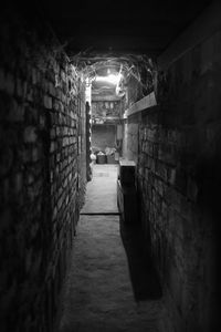 Narrow corridor along walls and buildings