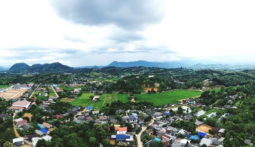 High angle view of buildings in city against sky