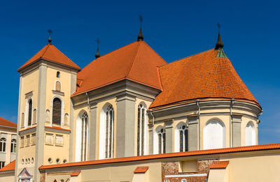 Low angle view of historic building against clear blue sky