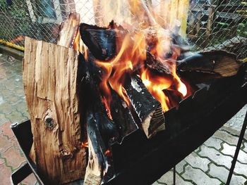 High angle view of fire on wood