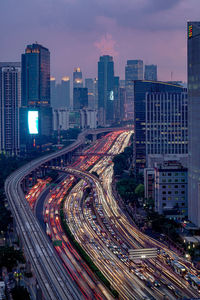 High angle view of illuminated buildings in city