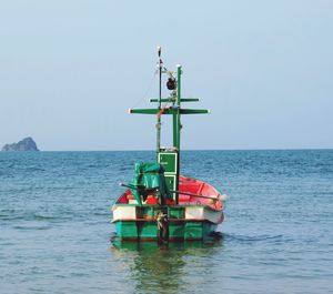 Ship in sea against clear sky