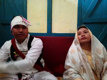 Couple sitting at wedding ceremony