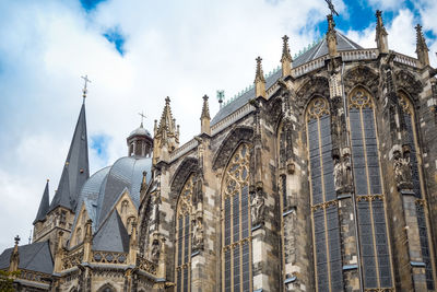 Low angle view of aachen cathedral against sky