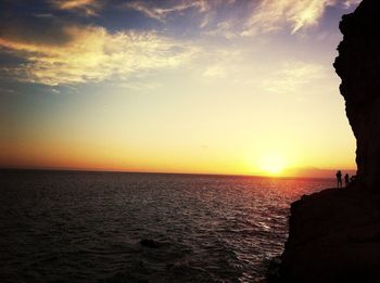 Scenic view of sea at sunset