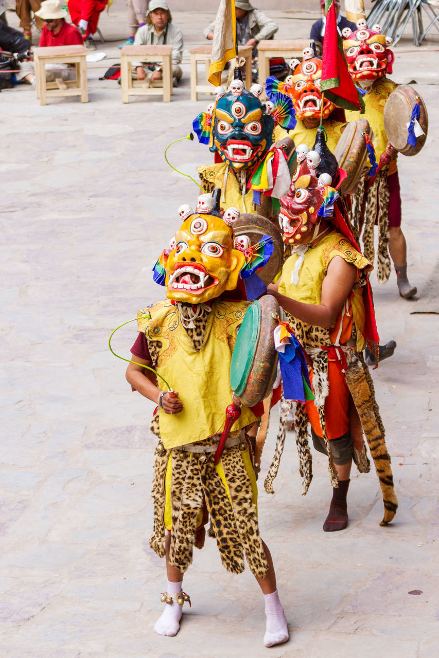 FULL FRAME SHOT OF MULTI COLORED MASK IN TRADITIONAL CLOTHING