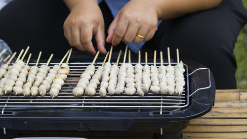 Midsection of man preparing food