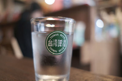 Close-up of beer glass on table