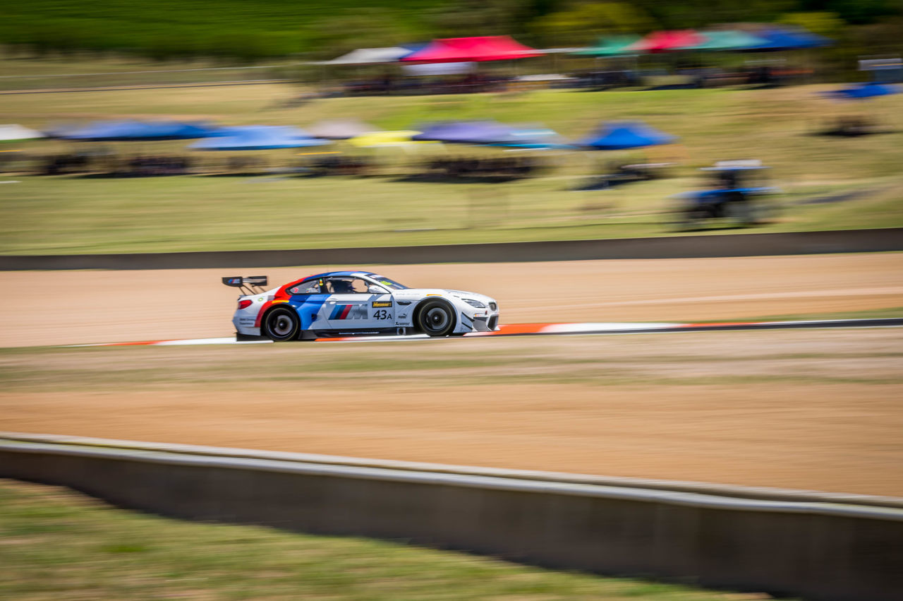 transportation, mode of transportation, competition, speed, motion, car, sports race, sport, blurred motion, motor vehicle, competitive sport, land vehicle, professional sport, racecar, motorsport, day, on the move, nature, driving, auto racing, motor racing track