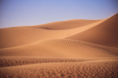 Scenic view of desert against clear sky