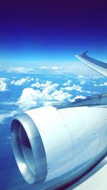 Cropped image of airplane flying over landscape