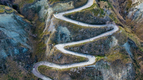 High angle view of tire tracks on road