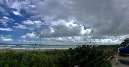 Scenic view of sea against storm clouds