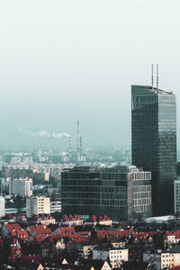 High angle view of buildings in city against clear sky