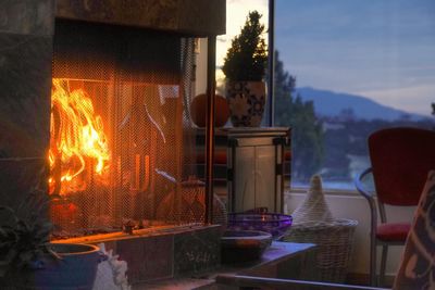 View of lit candles on table at home