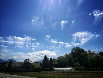 Scenic view of landscape against blue sky