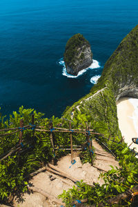 High angle view of rocks by sea