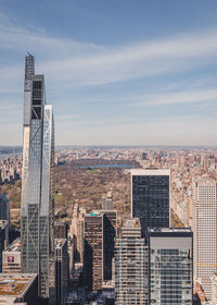 Modern buildings in city against sky