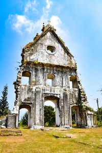 Low angle view of old church building against sky