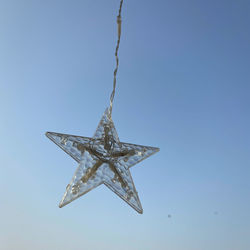 Close-up of star shape decoration against clear sky