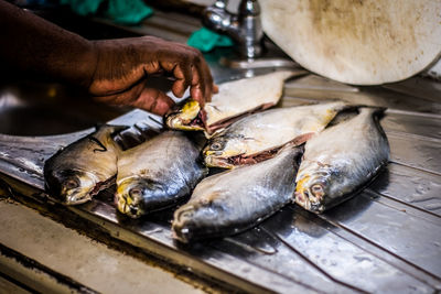 Cropped image of person preparing food