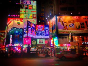 Illuminated city street at night