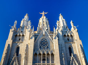 Low angle view of building against blue sky