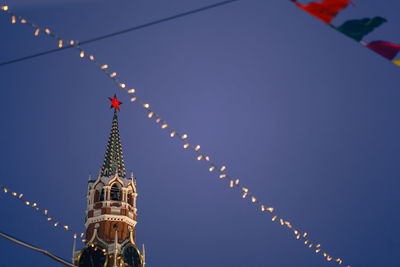 Low angle view of illuminated building against sky