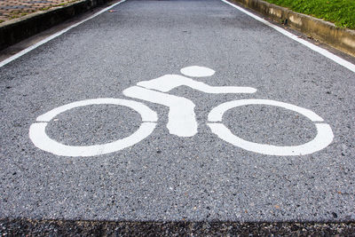 High angle view of arrow symbol on road