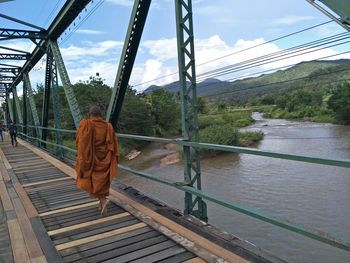 Bridge over river against sky