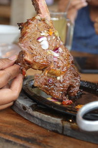 Cropped hand of person preparing food