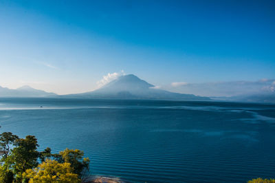 Scenic view of sea against blue sky