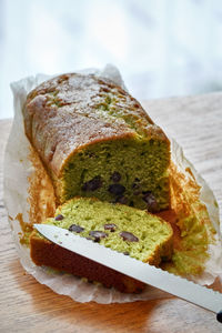 High angle view of cake and a knife on table