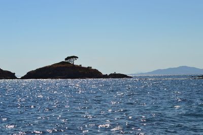 Scenic view of sea against clear blue sky