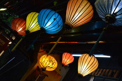 Low angle view of illuminated lanterns hanging for sale