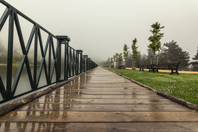 View of footbridge against clear sky