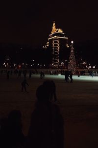 Group of people in front of building at night