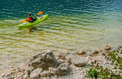 High angle view of man kayaking in river