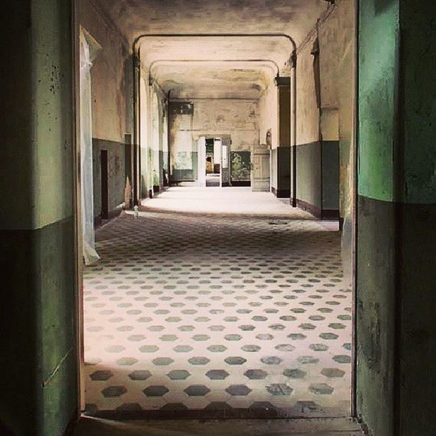 indoors, architecture, built structure, corridor, the way forward, empty, absence, ceiling, in a row, diminishing perspective, sunlight, architectural column, no people, house, building, window, flooring, day, narrow, door