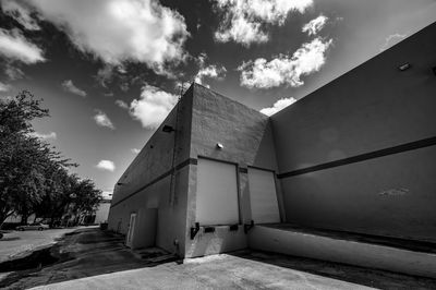 Low angle view of abandoned building against sky