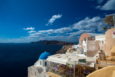 Buildings against blue sky and clouds